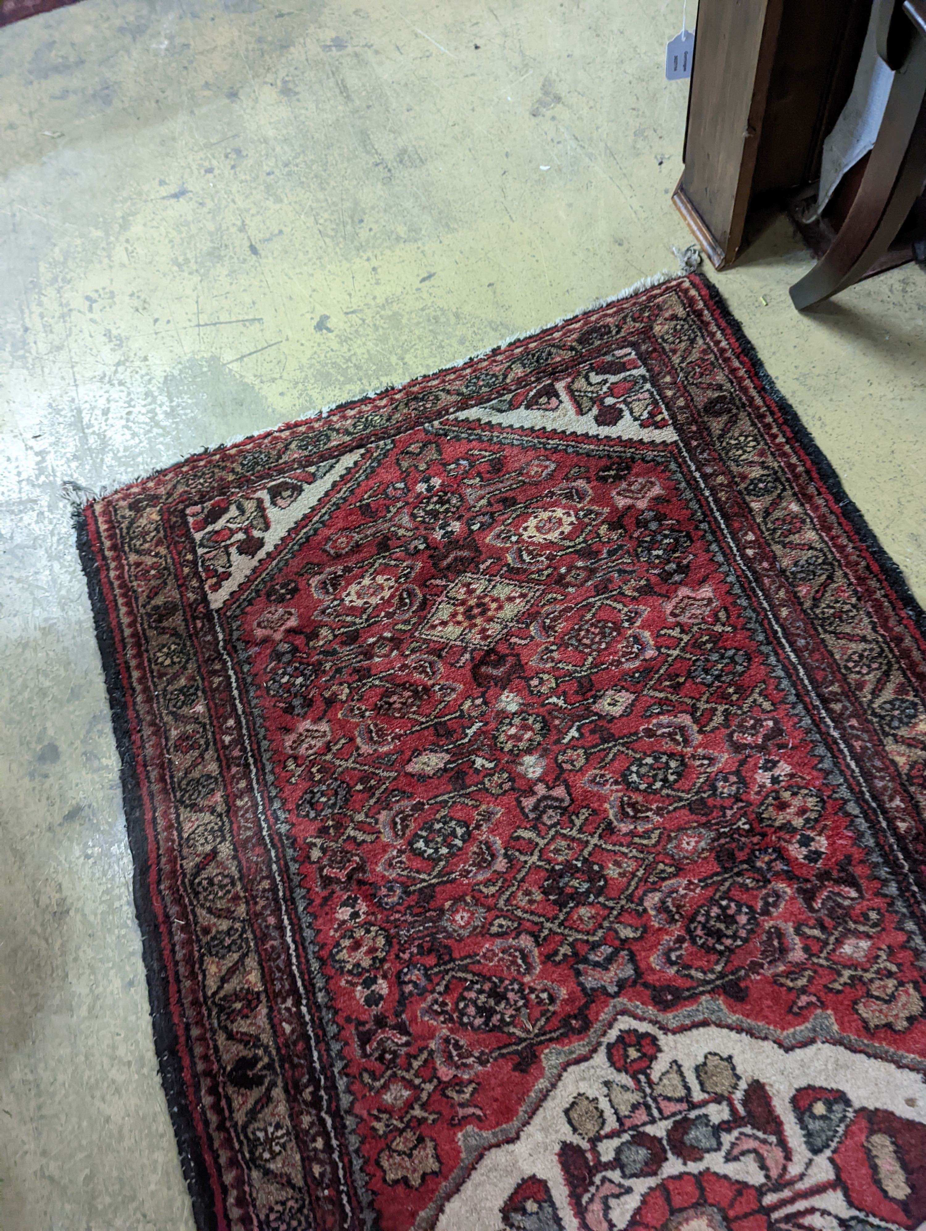 A Hamadan red ground rug, 190 x 82cm